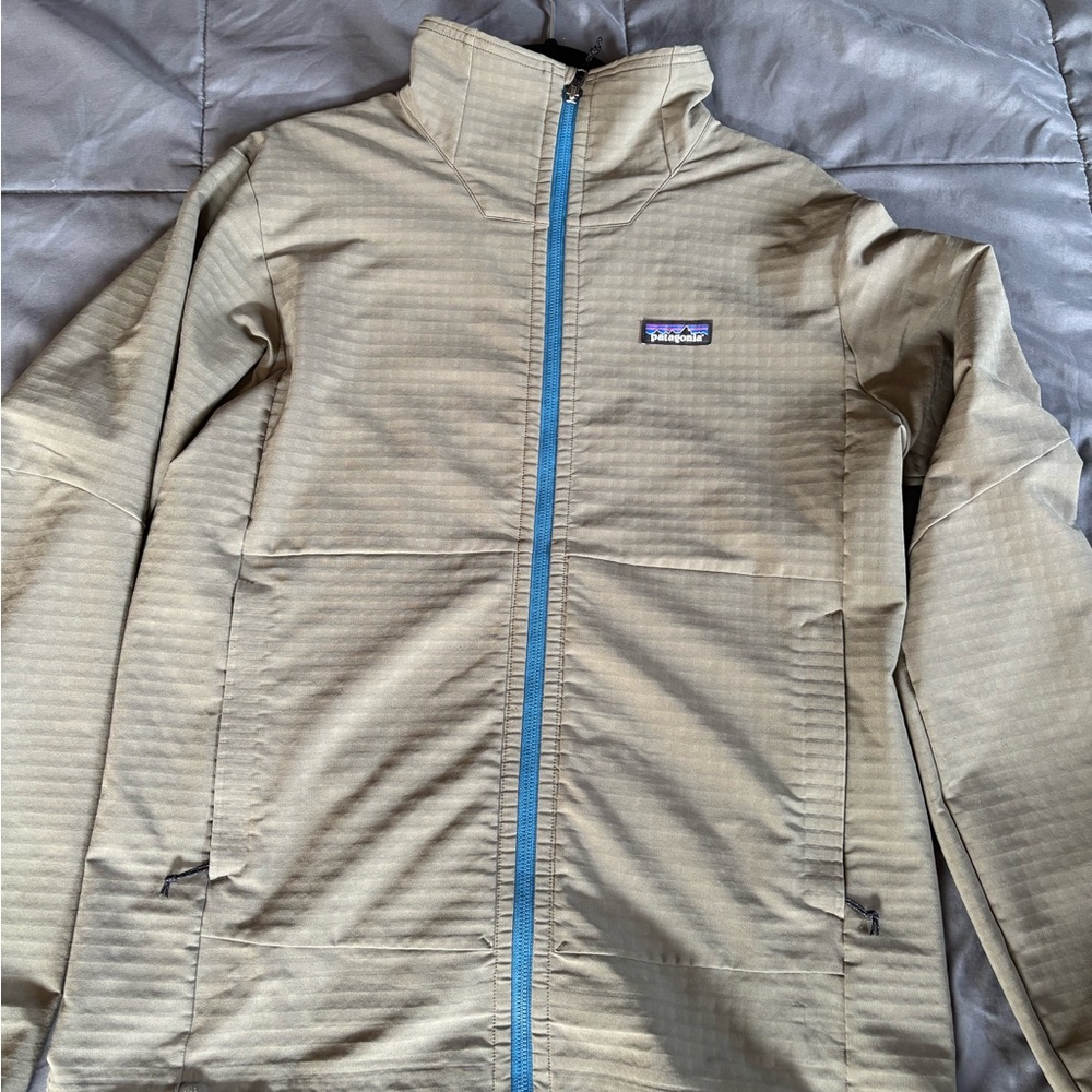 Patagonia Green Jacket with Vibrant Blue Zipper